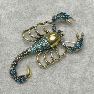 Sparkling Blue Rhinestone on Gold Tone Scorpion Brooch